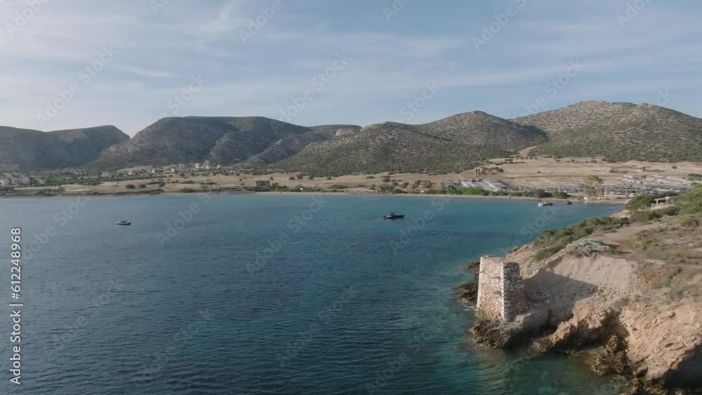 Aerial flight along coastline of Patroklos Island during sunny day in Greece Aerial flight along coastline of Patroklos Island during sunny day in Greece