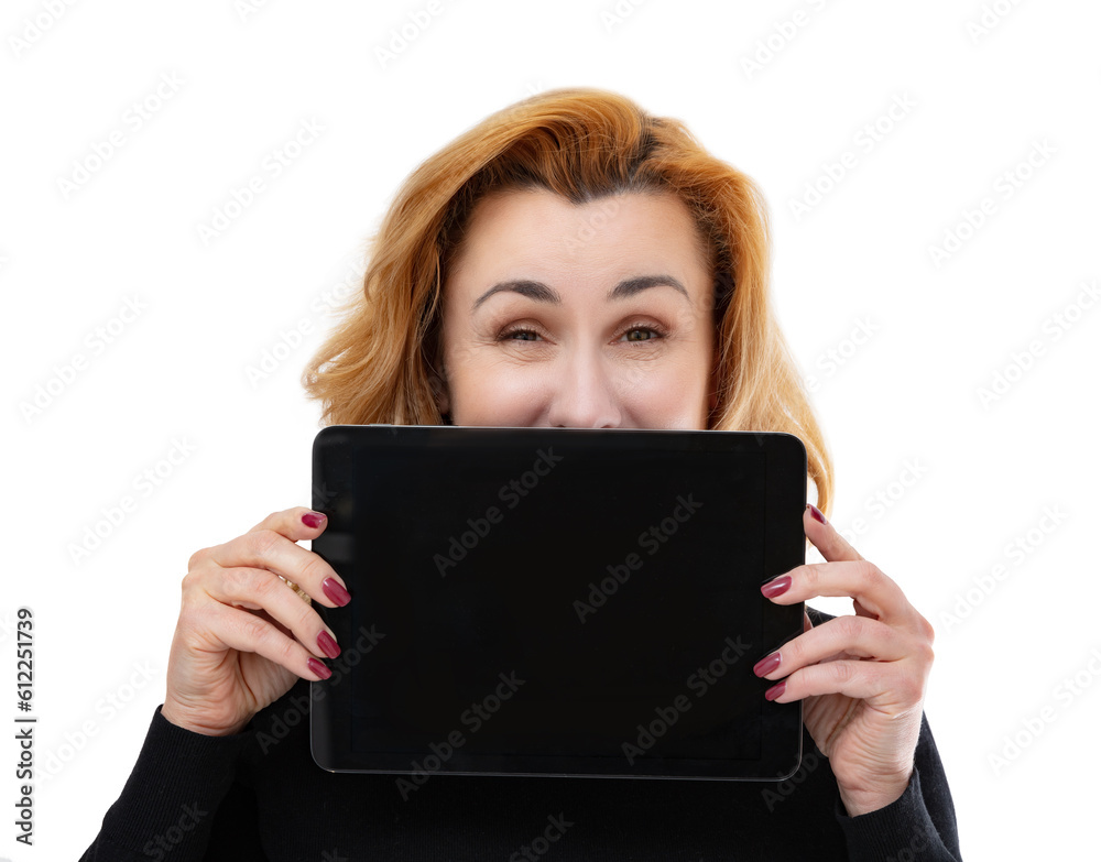 Portrait of forty year old woman shows something interesting on the tablet screen, isolated on white background. Woman in black turtleneck smiling and posing in studio. Portrait of forty year old woman shows something interesting on the tablet screen, isolated on white background. Woman in black turtleneck smiling and posing in studio.
