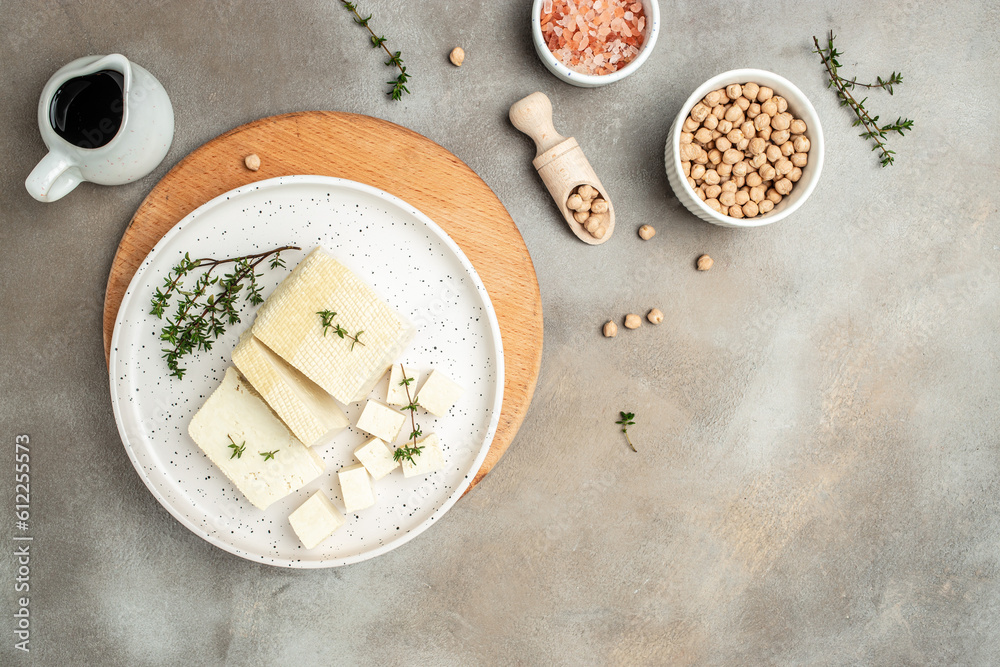 tofu cheese cubes on a light background. banner, menu, recipe place for text, top view tofu cheese cubes on a light background. banner, menu, recipe place for text, top view
