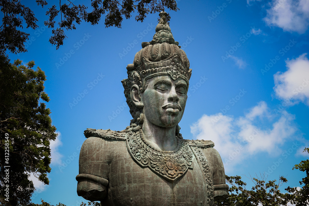 A large copper statue of Wisnu's torso and head at the GWK Cultural Park in Bali, Indonesia