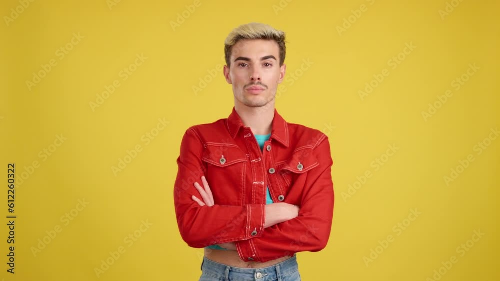 Gay man in colorful clothes looking at camera Gay man in colorful clothes looking at camera