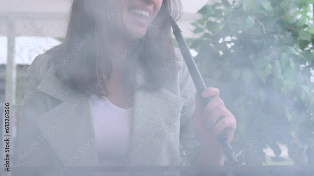girl woman smoking hookah in terrace restaurant sitting with coffee cup on table,typing message on phone.female with cold sore herpes hpv virus on lips 4k.hookan man putting coal cubes on tabaco bowl