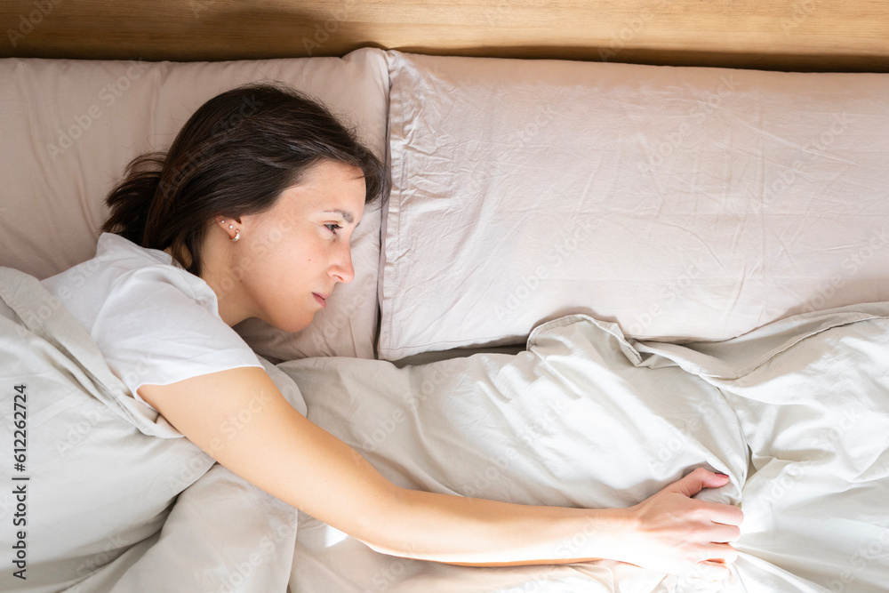 Girl in her double bed, wakes up with one arm on the side where a person is missing
Girl in her double bed, wakes up with one arm on the side where a person is missing