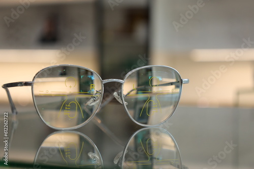 glasses on the table, eyeglass progressive lens on table in clinic 