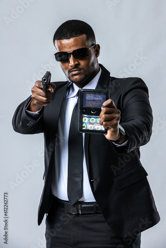Undercover Law Enforcement Special Agent with weapon.  a secret service agent. secret service security bodyguard agent.  Portrait of secret agent standing. photo