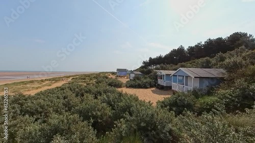 Wallpaper Mural Push in shot of traditional wooden beach huts and surf shacks on Hunstanton's south beach on the North Norfolk coast. captured on a bright and sunny morning Torontodigital.ca