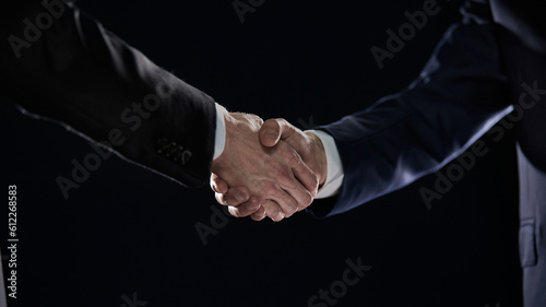 Close-up image of handshake between two colleagues.