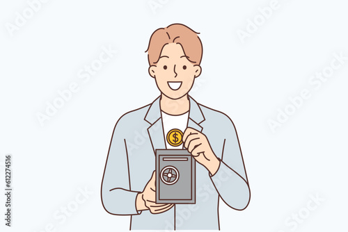 Man with safe for money recommends using reliable bank deposit for capital accumulation