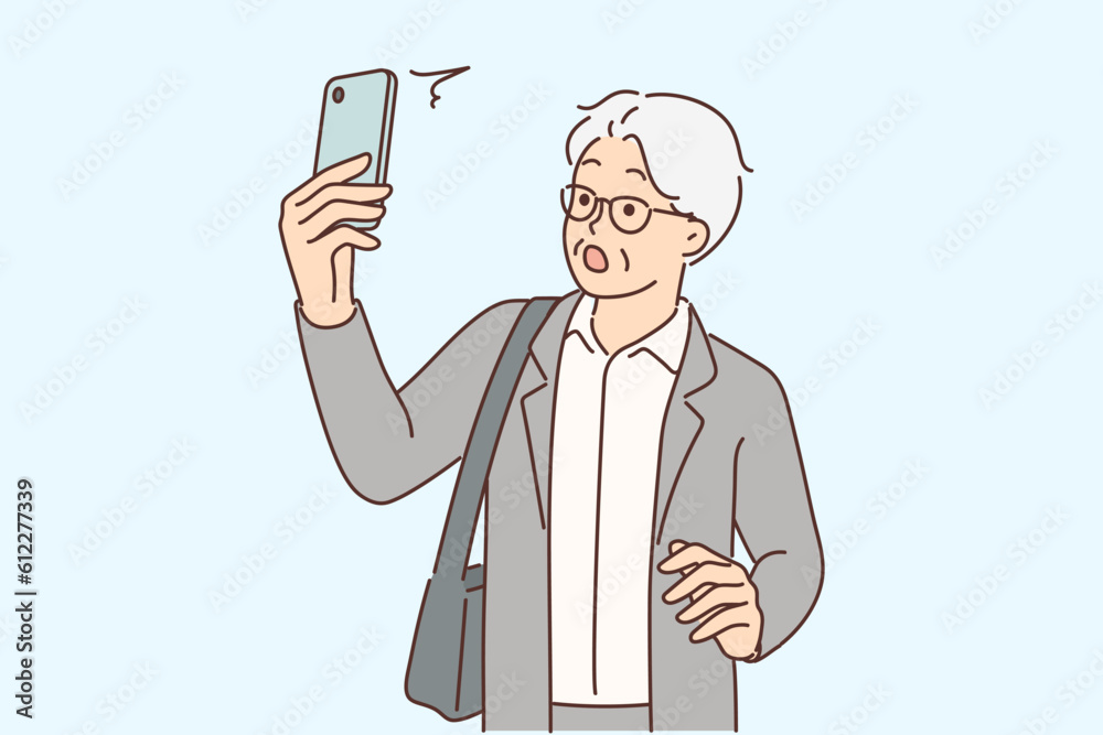 Elderly man with phone is shocked by news saw in application or sms message from business partner