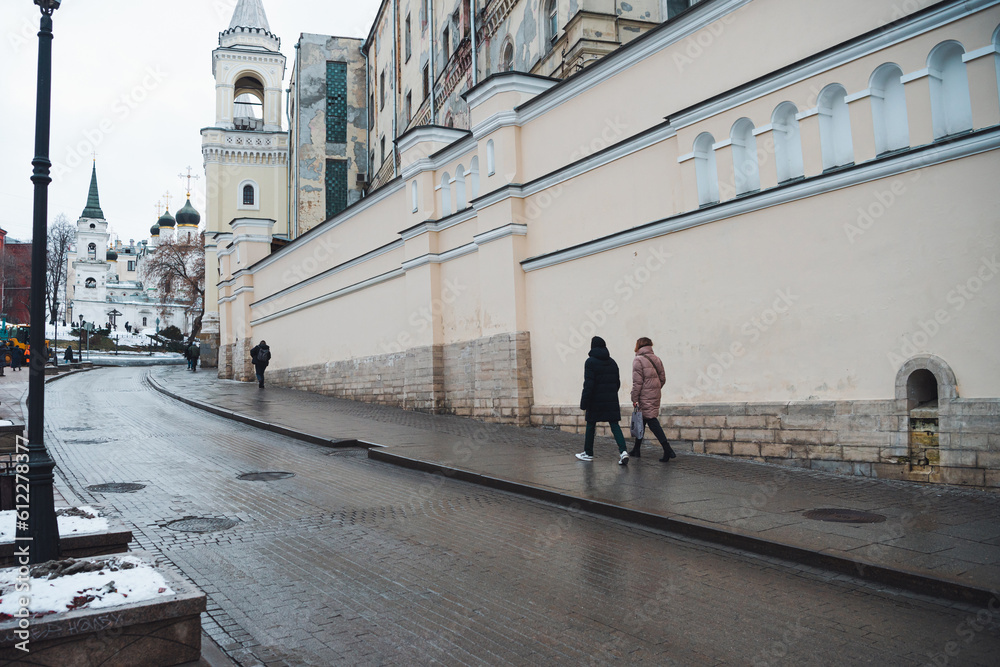 Moscow street in the city center. street photography. people go about their business. stone paving. Moscow