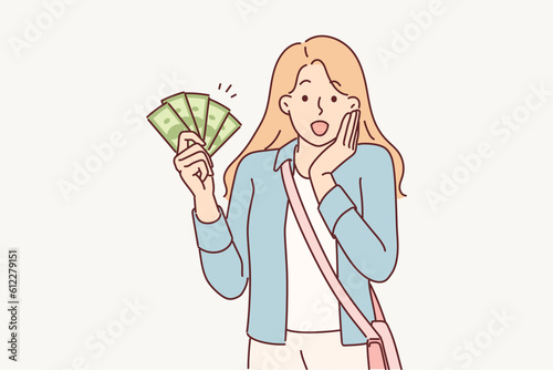 Woman with cash screams wow rejoicing at big purchase bonus or cashback after shopping