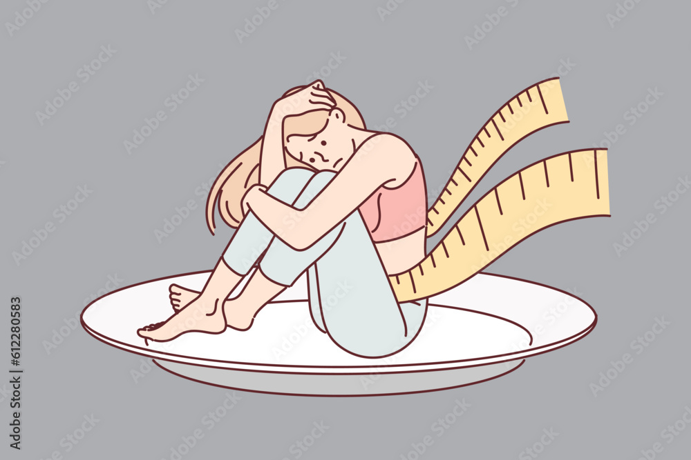 Woman with anorexia or dystrophy sits on giant plate with measuring tape around waist