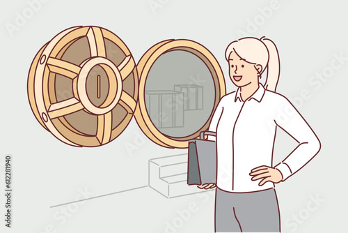 Woman near bank safe for storing precious metals and clients money to advertise safe deposit
