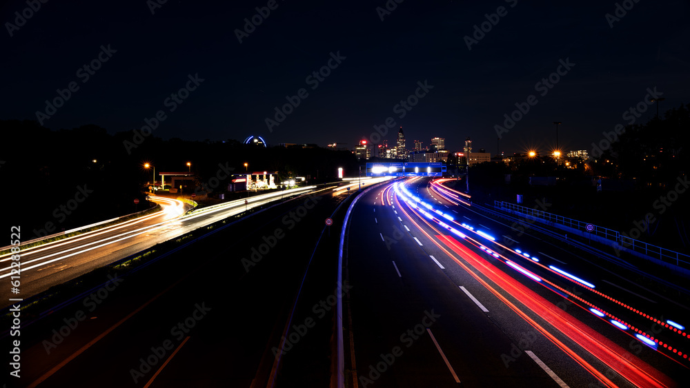 Frankfurt am Main city highway at night. Long exposure of the street. Light beams from the cars.