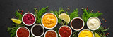 Different types of sauces in bowls with seasonings banner, rosemary and dill, thyme and and peppercorns, top view, copy space
