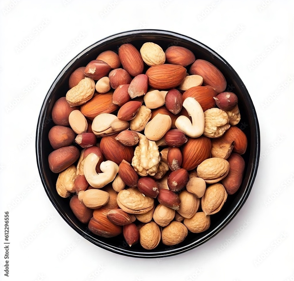 The nuts in black bowl isolated on white background. Top view. The nuts in black bowl isolated on white background. Top view.