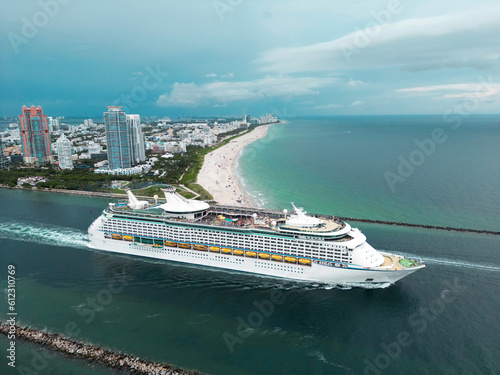 Cruise ship. Miami Beach, cruise boat liner. Cruises in Miami city, South Point Park in Miami Beach, aerial view of cruise liner. Beach coast of Miami Beach, cruise liner, summer travel.