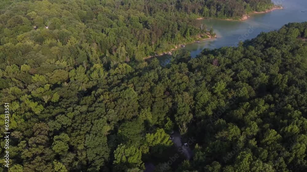 Flying towards Cave Run cave in Kentucky, you can witness a hidden bay where recreational boats are docked. Flying towards Cave Run cave in Kentucky, you can witness a hidden bay where recreational boats are docked.