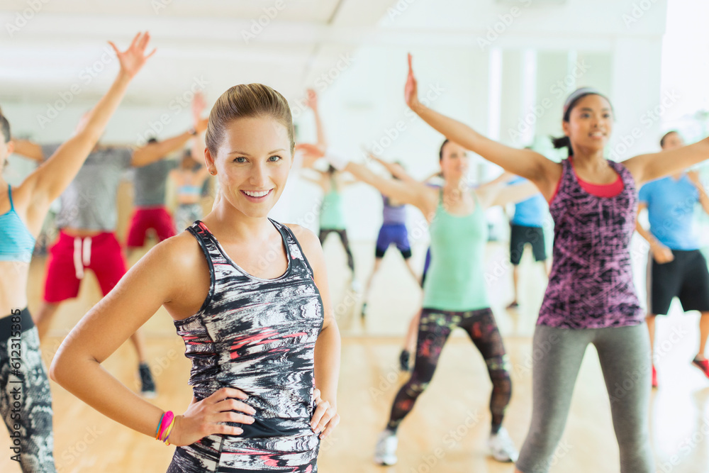 Fototapeta premium Portrait smiling woman in exercise class