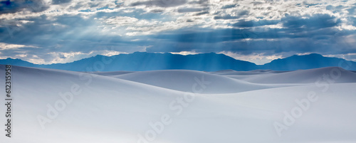 Sunbeams over tranquil white sdunes, White Sands, New Mexico, United States