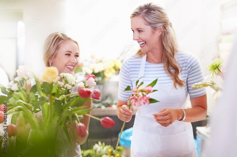 Laughing florists arranging bouquet in flower shop Laughing florists arranging bouquet in flower shop