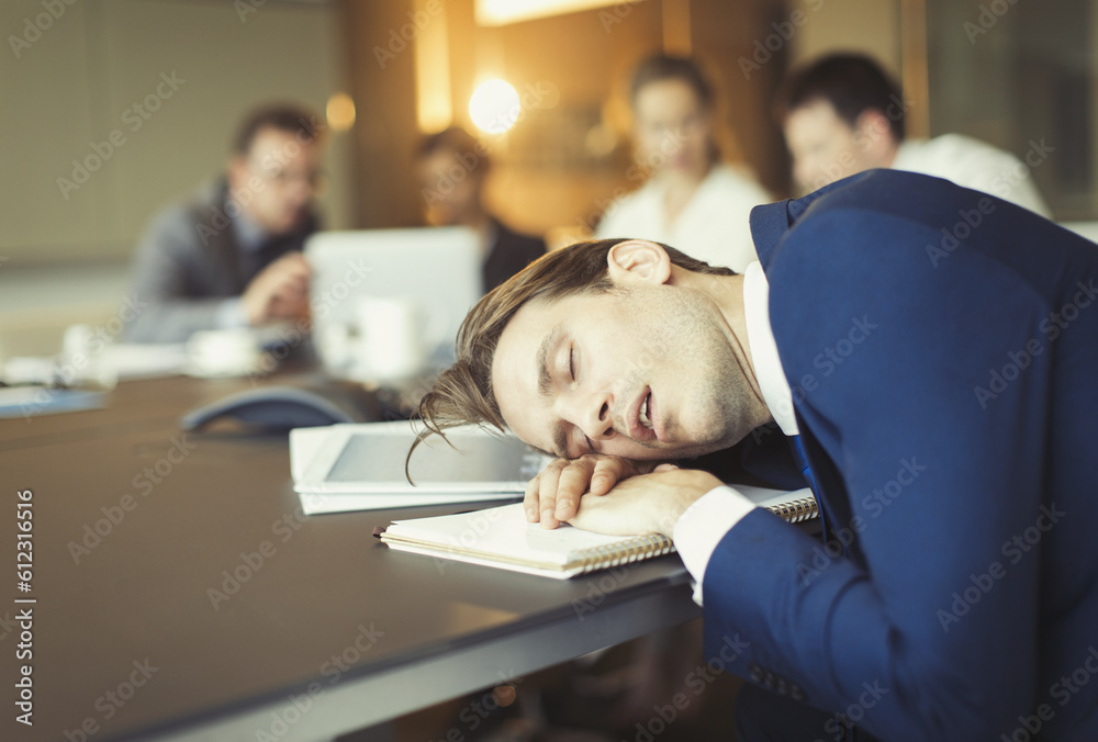 Businessman sleeping in conference room meeting Businessman sleeping in conference room meeting
