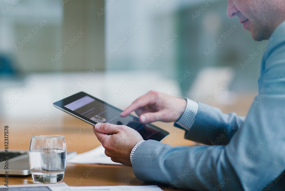 Businessman using digital tablet in office