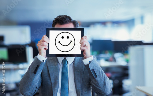 Photos Portrait of businessman covering face with digital tablet in office