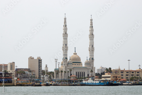 big mosque at the bank of suez canal at portsaid. Mosque located on Suez canal in the city of Portsaid in Egypt photo
