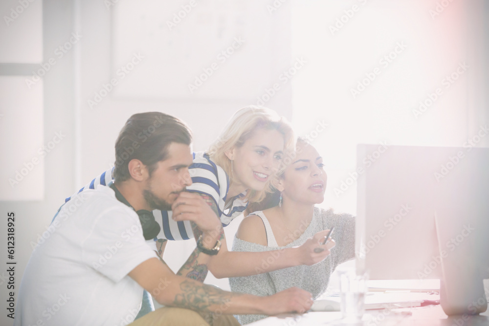 Fototapeta premium Young creative business people working at computer