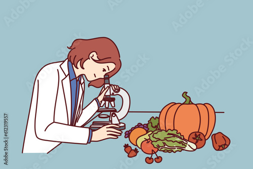 Checking quality of food in laboratory by woman using microscope to look for nitrates and pesticides. Girl scientist controls quality of products of grocery store and works in field of food technology
