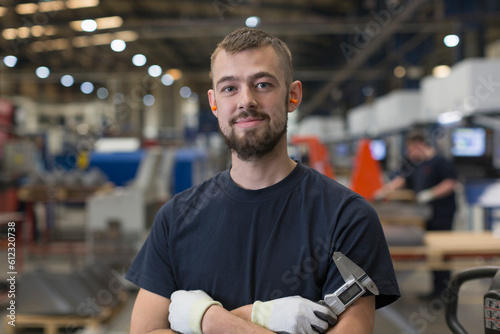 Portrait confident worker in steel factory