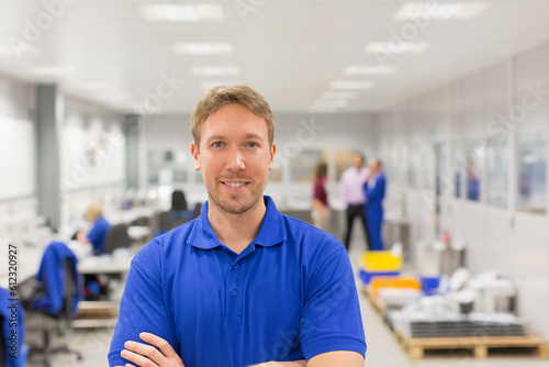 Portrait smiling worker in steel factory office