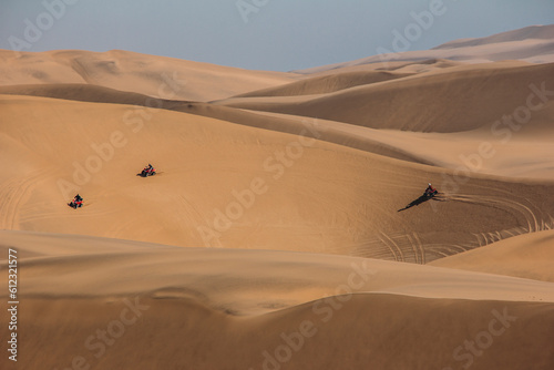 Friends riding quadbikes in desert  Swakopmund  Namibia