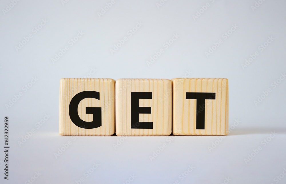 GET symbol. Concept word GET on wooden cubes. Beautiful white background. Business and GET concept. Copy space. GET symbol. Concept word GET on wooden cubes. Beautiful white background. Business and GET concept. Copy space.