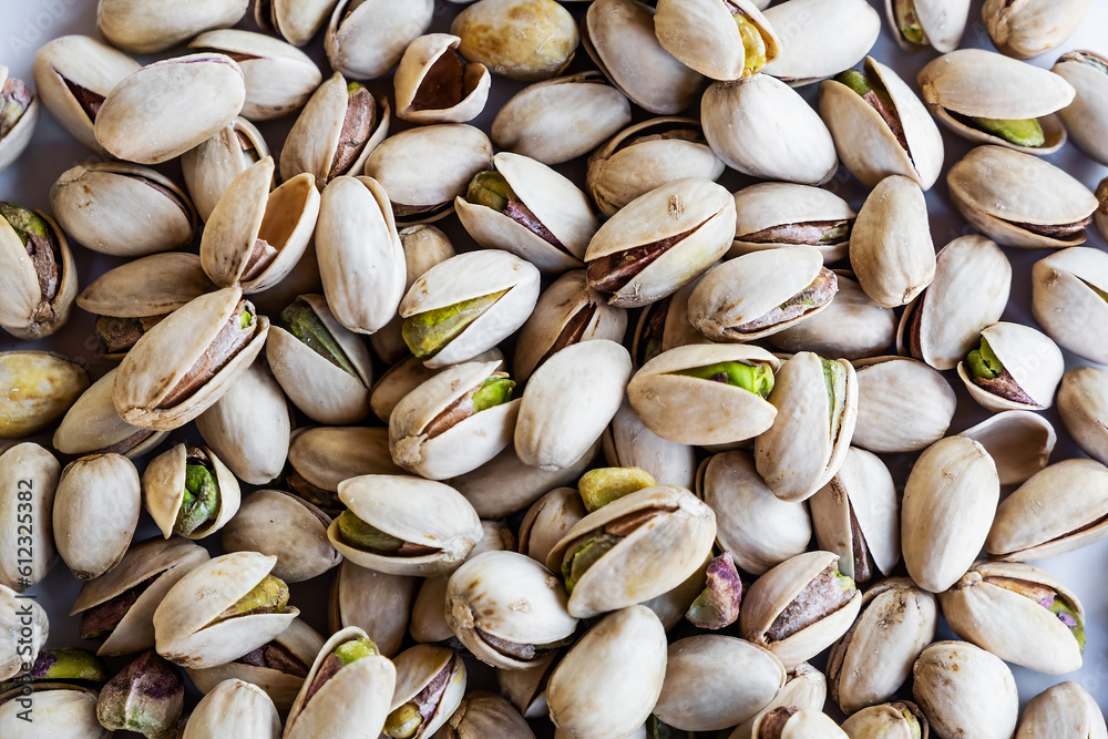 Pistachios texture and background . Tasty pistachios as background,as pistachios texture, flat lay.