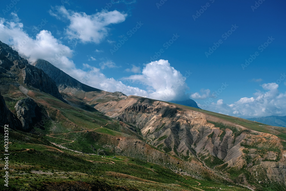 Fototapeta premium Mountain valley with blue sky and clouds