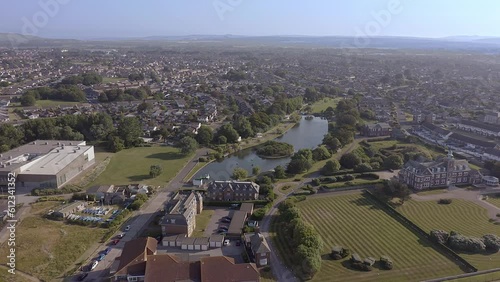 Mewsbrook Park on the border between Littlehampton and Rustington, a popular park with Art Deco shelters and a boating and wildlife lake, aerial footage. photo