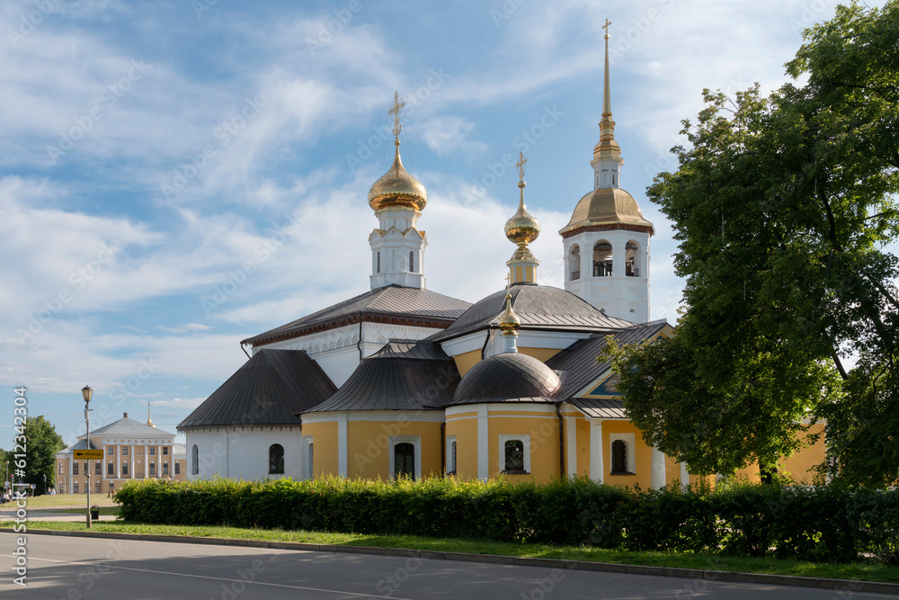 View of the Kazan Church (Church of the Kazan Icon of the Mother of God) and the Resurrection Church on the main square of the city on a sunny summer day, Suzdal, Vladimir region, Russia