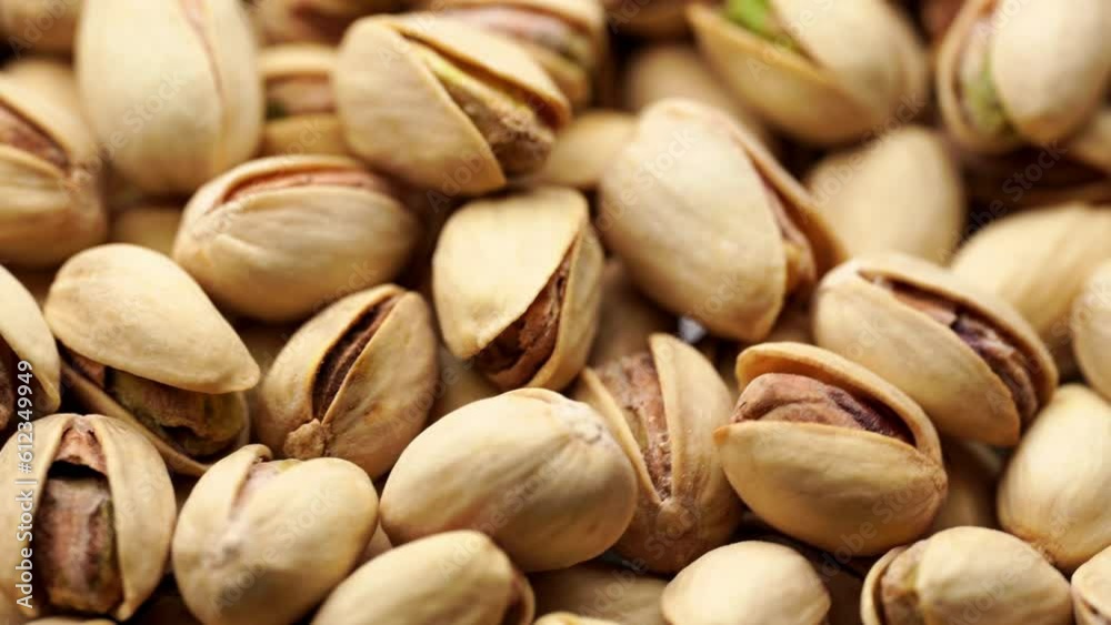 Salted Pistachios for Beer, Macro, Spin. Isolated Background of a Beer Snack of Salted Pistachio Nuts. Healthy Delicious Pistachios. Salted roasted pistachio macro, rotation Salted Pistachios for Beer, Macro, Spin. Isolated Background of a Beer Snack of Salted Pistachio Nuts. Healthy Delicious Pistachios. Salted roasted pistachio macro, rotation