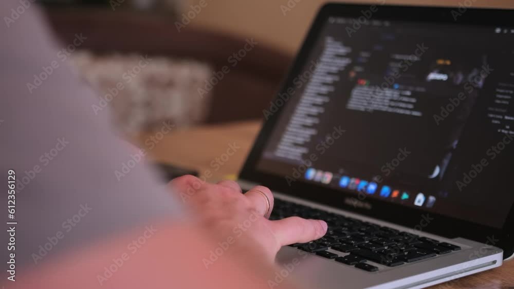 Male hands writing program codes on his computer screen close-up. IT specialist programmer work at home typing code on laptop. Freelancer and work at home concept. Remote work arrangements. Male hands writing program codes on his computer screen close-up. IT specialist programmer work at home typing code on laptop. Freelancer and work at home concept. Remote work arrangements.