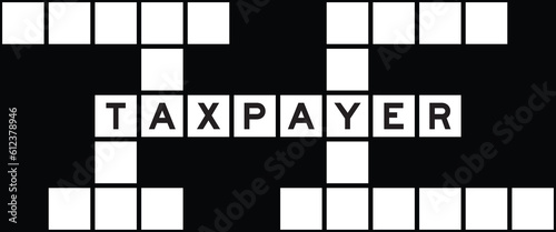 Alphabet letter in word taxpayer on crossword puzzle background