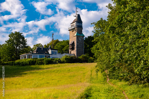 Historic telegraph tower “Danzturm“ in Iserlohn Germany is a landmark and view point with great panoramic view over Sauerland hills and scenery south east the Ruhr Basin on a sunny summer morning. photo