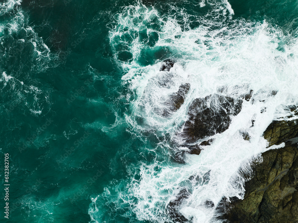 Obraz premium Top view Seashore cliff at Phuket Thailand, beautiful waves crashing on rocks seacoast in open sea summer landscape seascape,Nature environment and Travel background