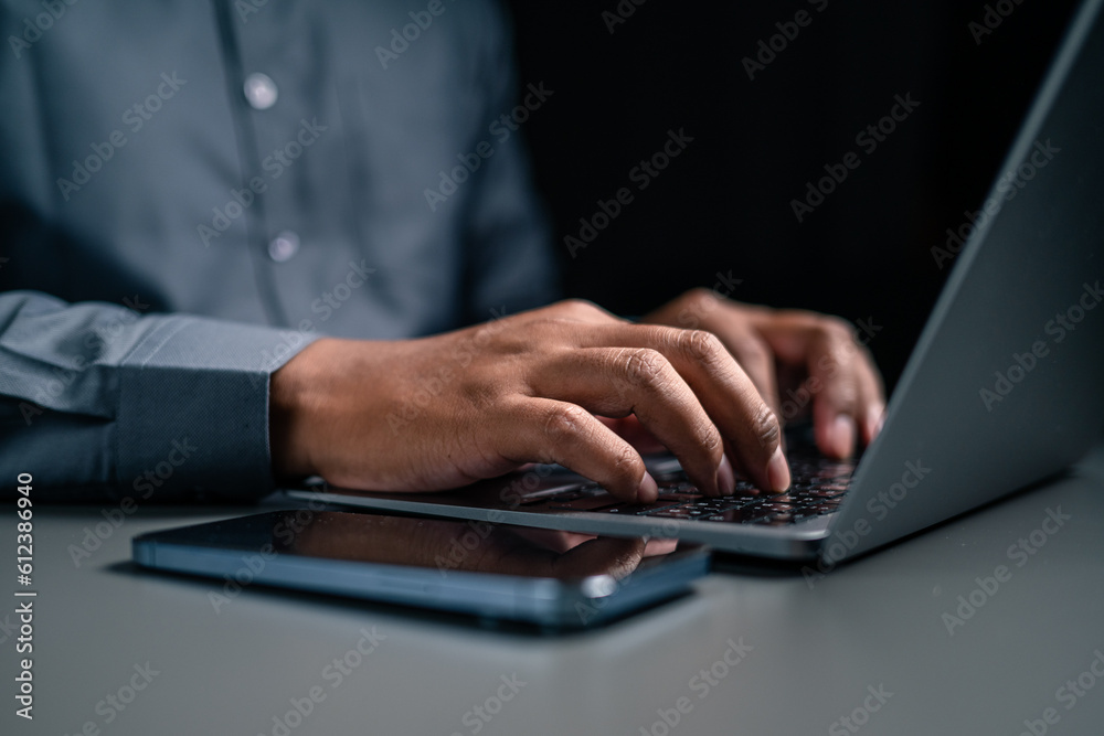 A man hand using laptop are working and Plan your savings money. A man hand using laptop are working and Plan your savings money.