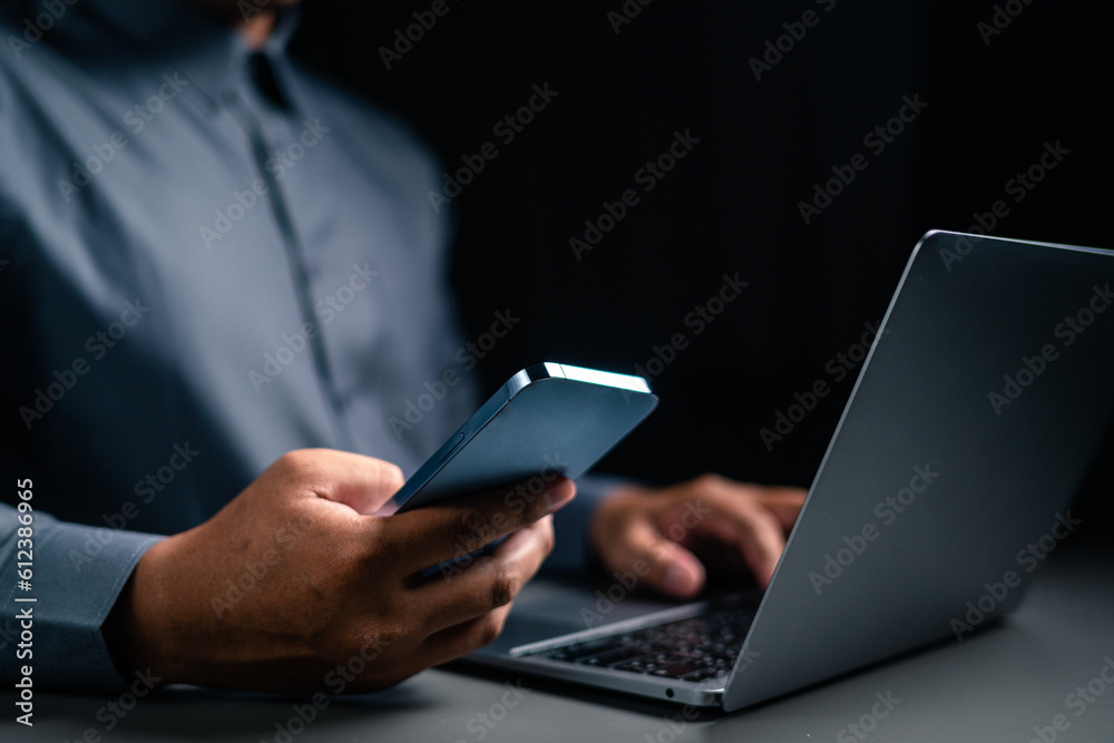 A man hand using mobile phone is paying money for home loan payment. A man hand using mobile phone is paying money for home loan payment.
