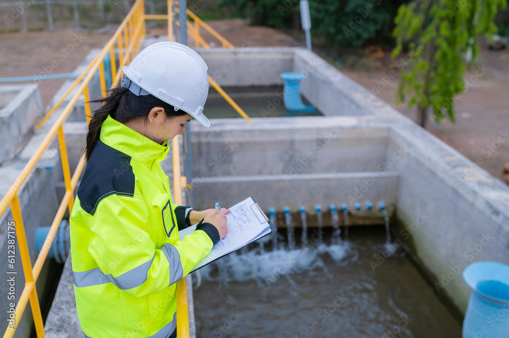 Fototapeta premium Environmental engineers work at wastewater treatment plants,Water supply engineering working at Water recycling plant for reuse,Check the amount of chlorine in the water to be within the criteria.