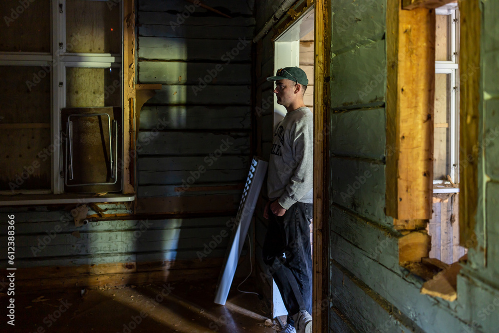 Skelleftea, Sweden A young man stands in an abandoned building Skelleftea, Sweden A young man stands in an abandoned building