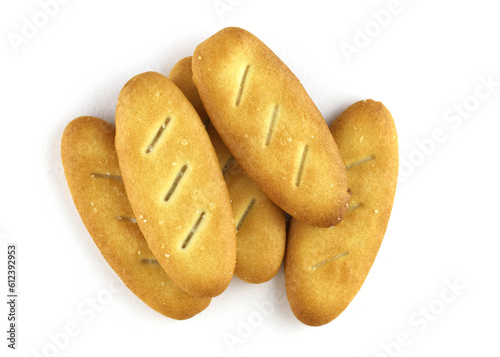 Salted crackers on a white background. Crispy biscuits top view. Top view of low calories thin oval crackers. Tasty snack