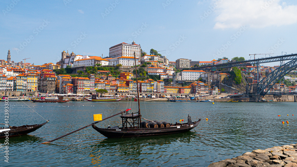 Panoramic view of the old town of Porto and the Douro river with traditional boats with wine barrels, Portugal